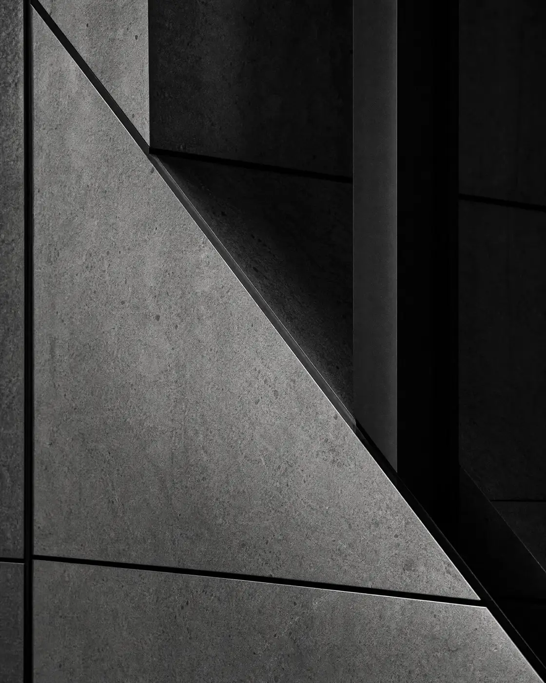 Monochrome intersection of stone panels and steel shadow lines